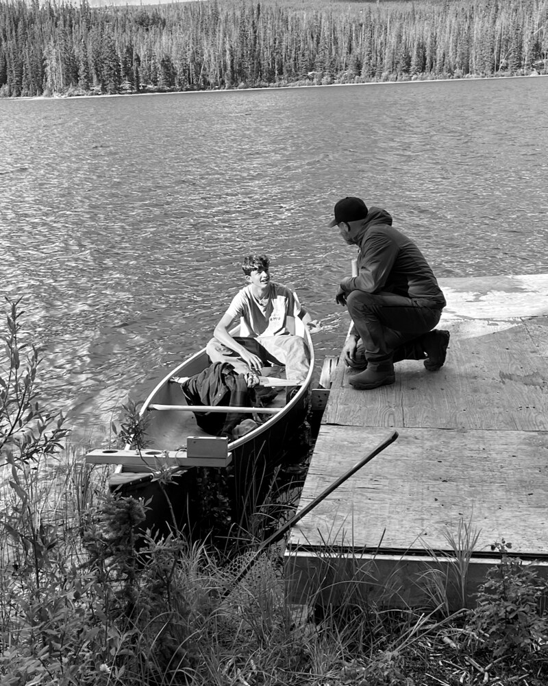 Colt in canoe, Stacy on the dock